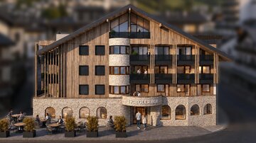 Ein modernes Hotelgebäude aus Holz und Stein, umgeben von kleinen Pflanzen. Vor dem Hotel sitzen Gäste an Tischen und genießen die Atmosphäre.